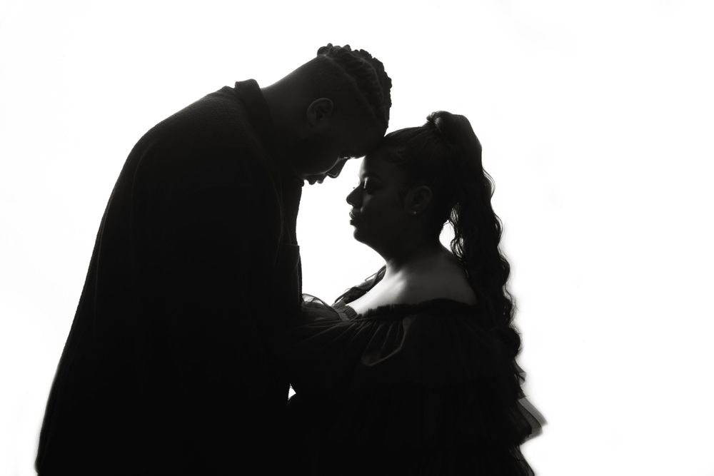 High contrast black and white silhouette of maternity portrait series.
