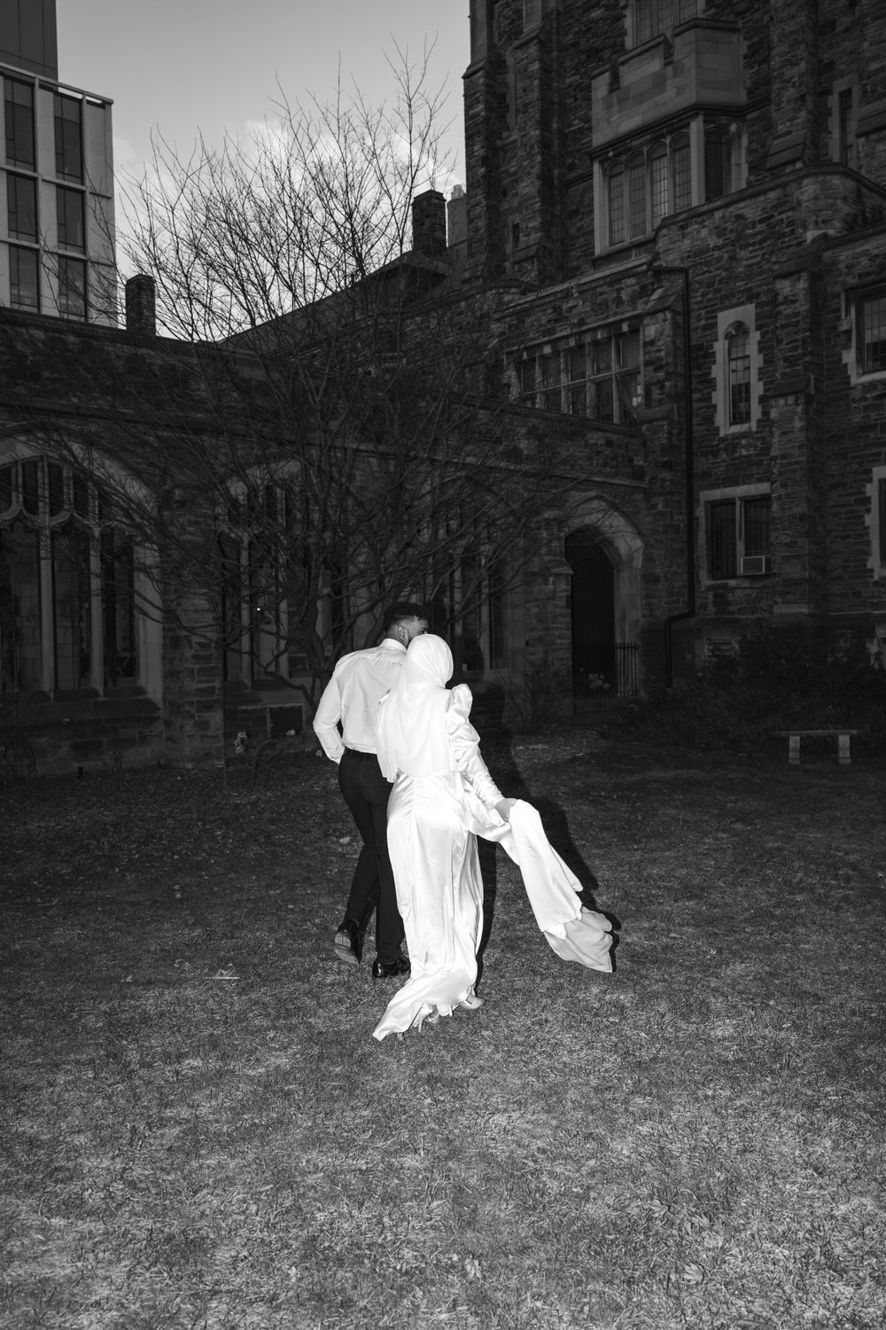 Couple running through the gardens during wedding photos in Toronto