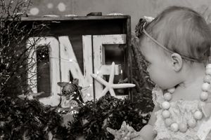 Black and white portrait series showing tender childhood moments.