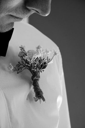 Close-up black and white detail shots of delicate floral bouquet arrangements.