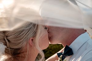 Intimate wedding portraits captured during golden hour outdoors.