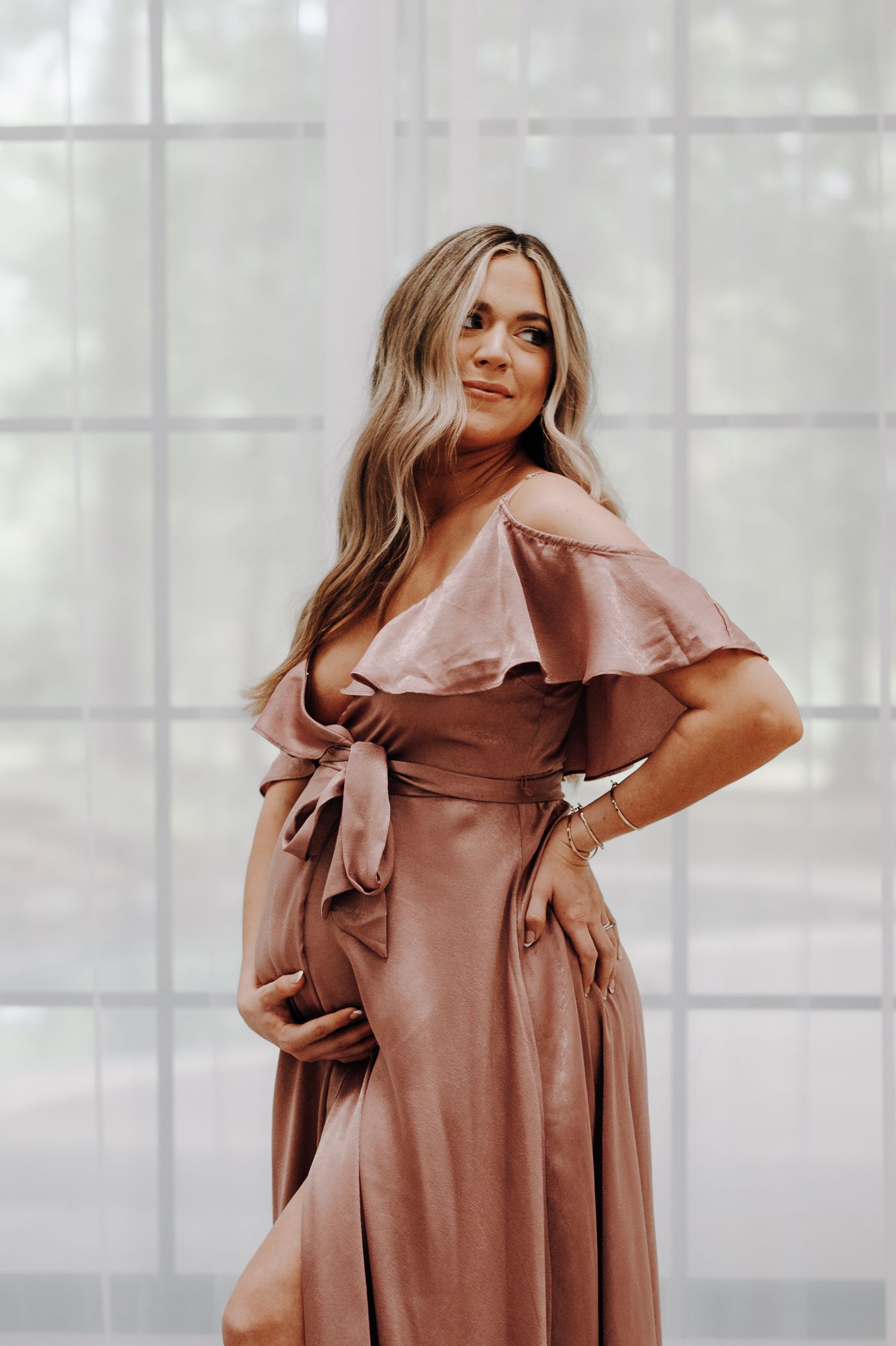Mother-to-be maternity session at Oak Atelier in Conroe, Tx. Dress is rose-colored satin from Lulu's.