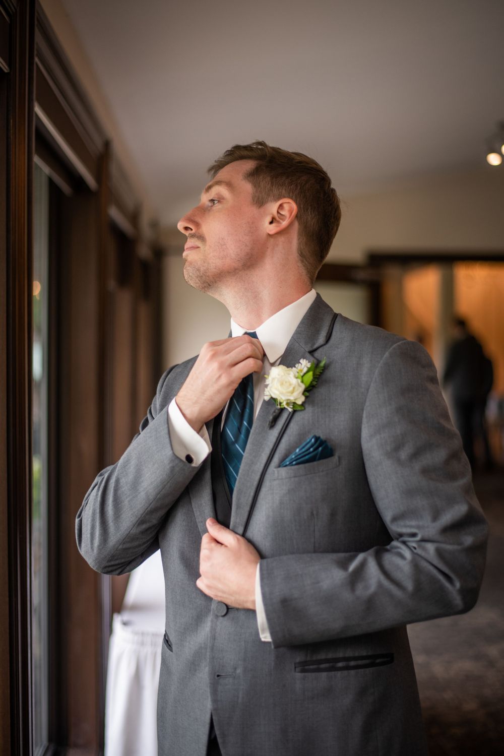 groom getting ready before wedding ceremony at Stratford Country Club