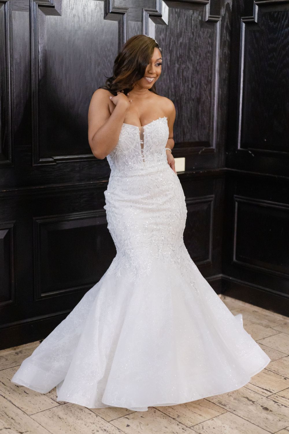 Elegant mermaid wedding dress with lace details and sweetheart neckline on display.