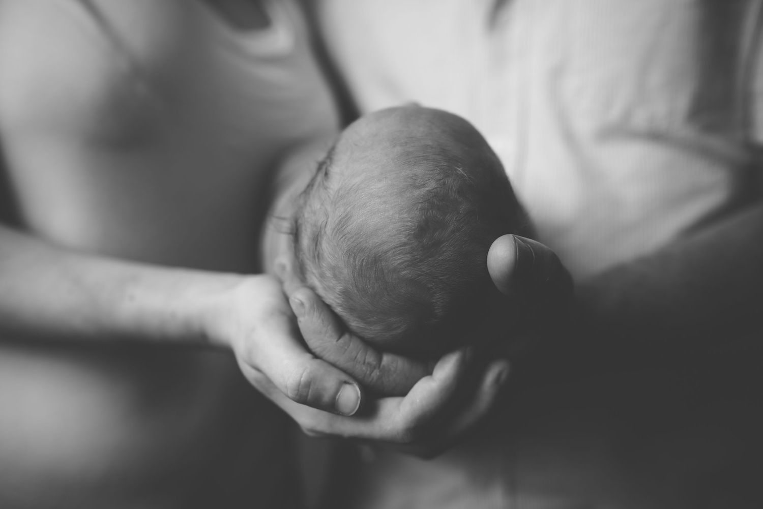 Artistic black and white close-up of baby details during newborn session.