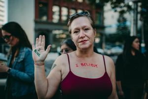 protester holds up hand with i believe written on it portland oregon photojournalism