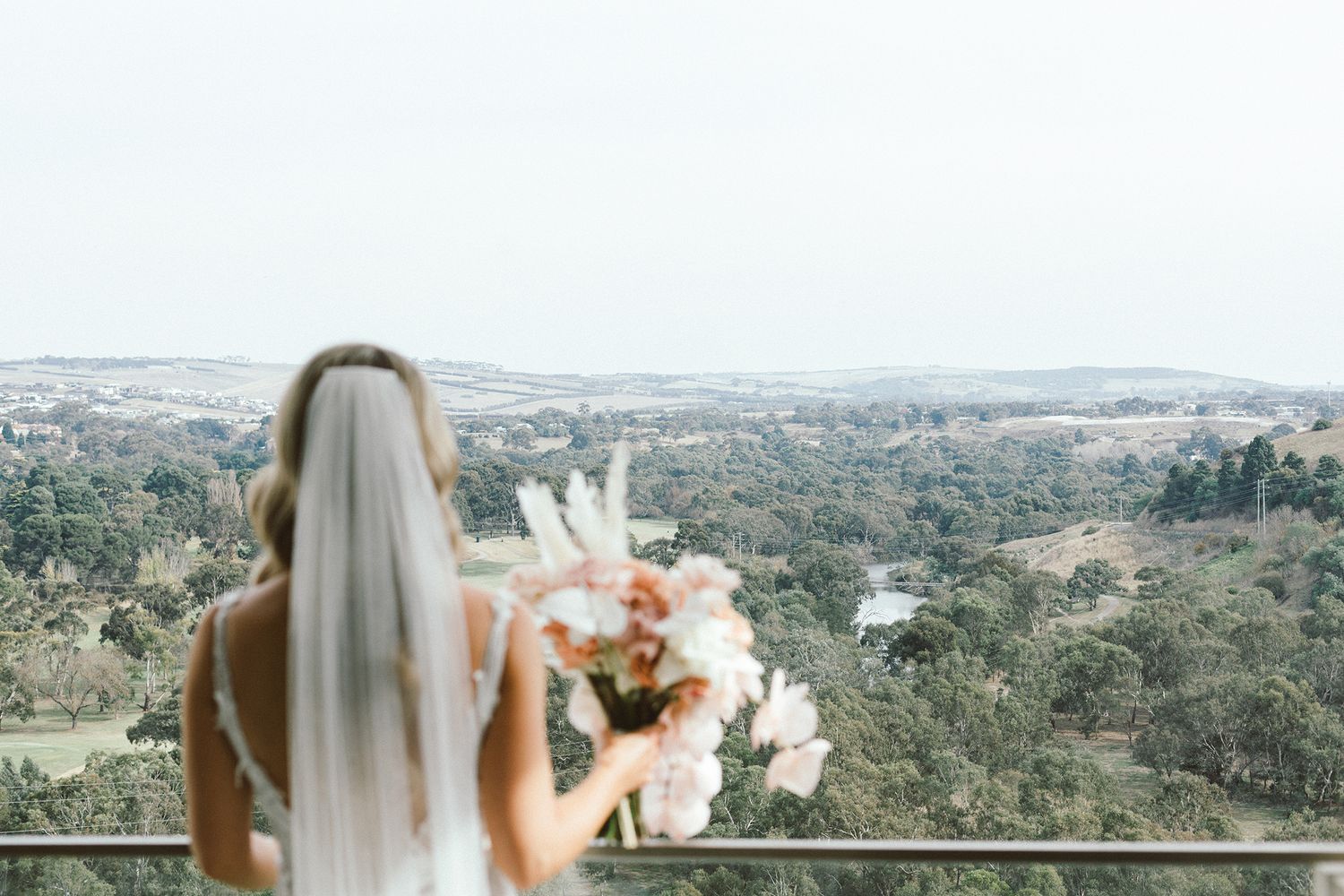 Scenic mountain landscape view with bridal veil and bouquet in foreground.