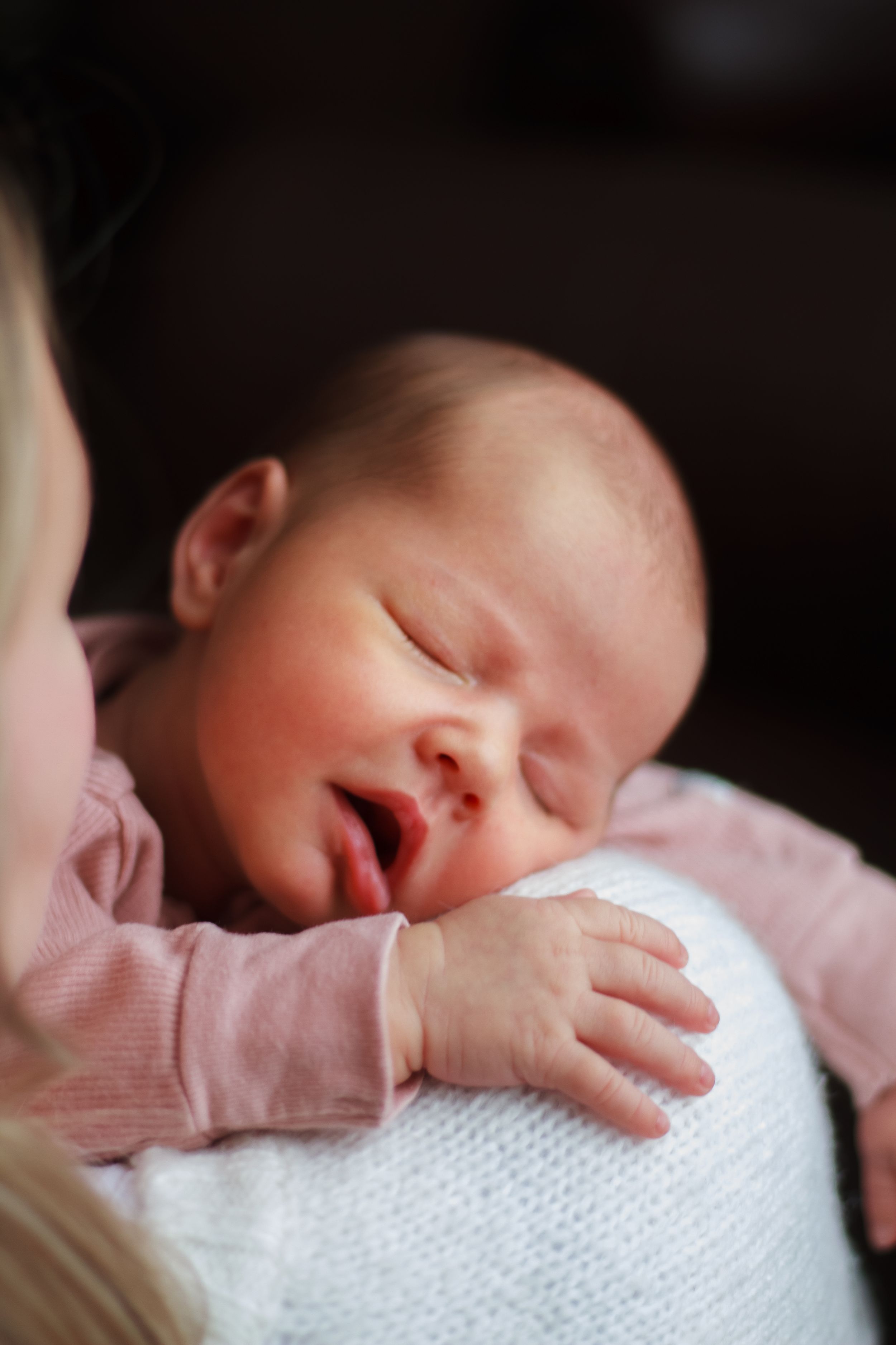 Close up of newborn baby sleeping during lifestyle session.