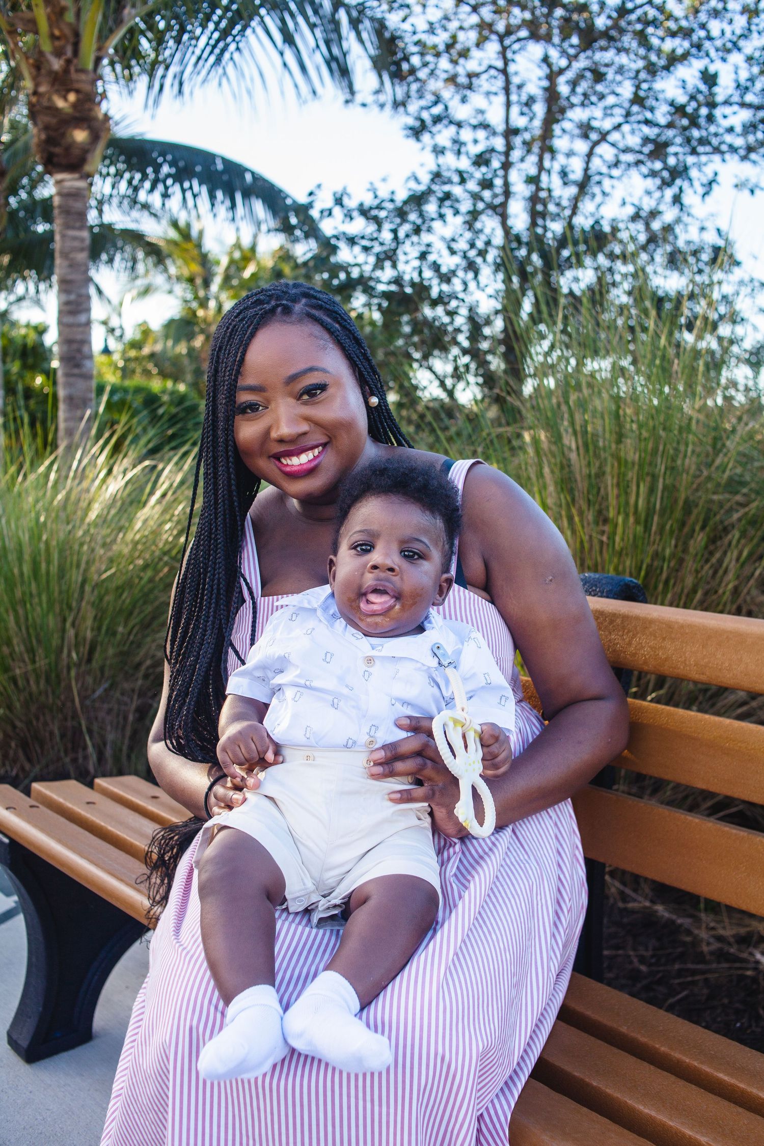 mom and baby sitting on a bench
