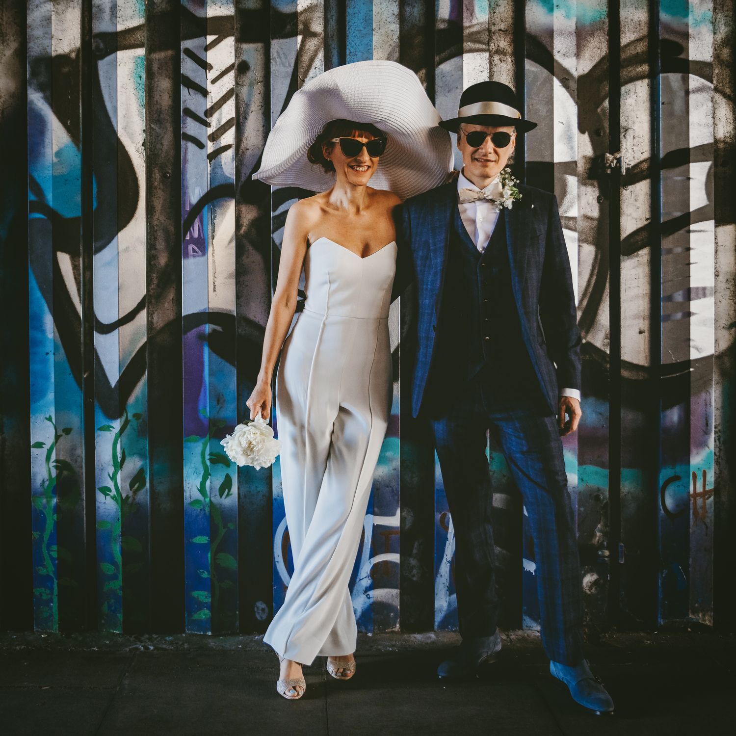 Hackney Bride and Groom with graffiti background, near hackney Town Hall.