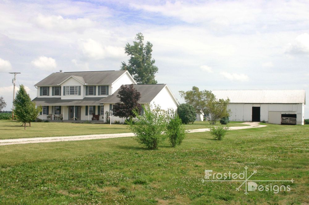 Front perspective of home and barn for real estate photography.