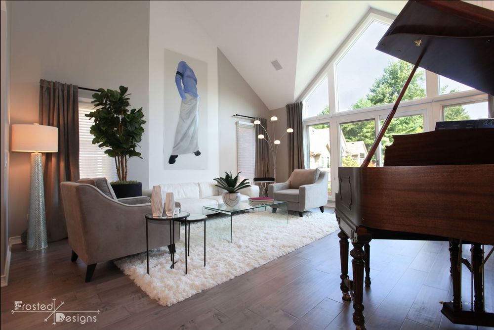 Custom Interior Designed formal living room with piano and unique artwork.