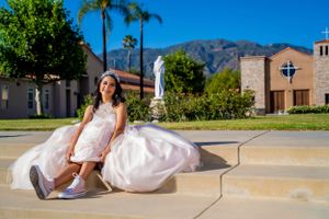 A playful pose on church steps in a pink ballgown and white sneakers. sylmar.