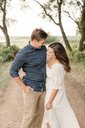 Laughing couple on a wooded park path in Georgetown, Texas