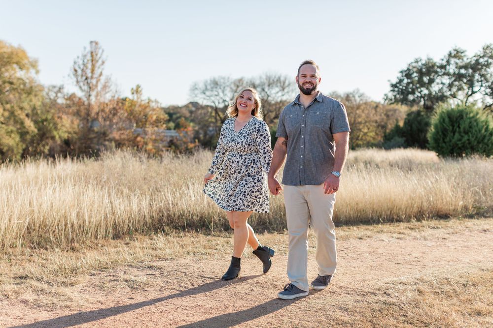 Couple walking in park during portrait session in Austin Texas