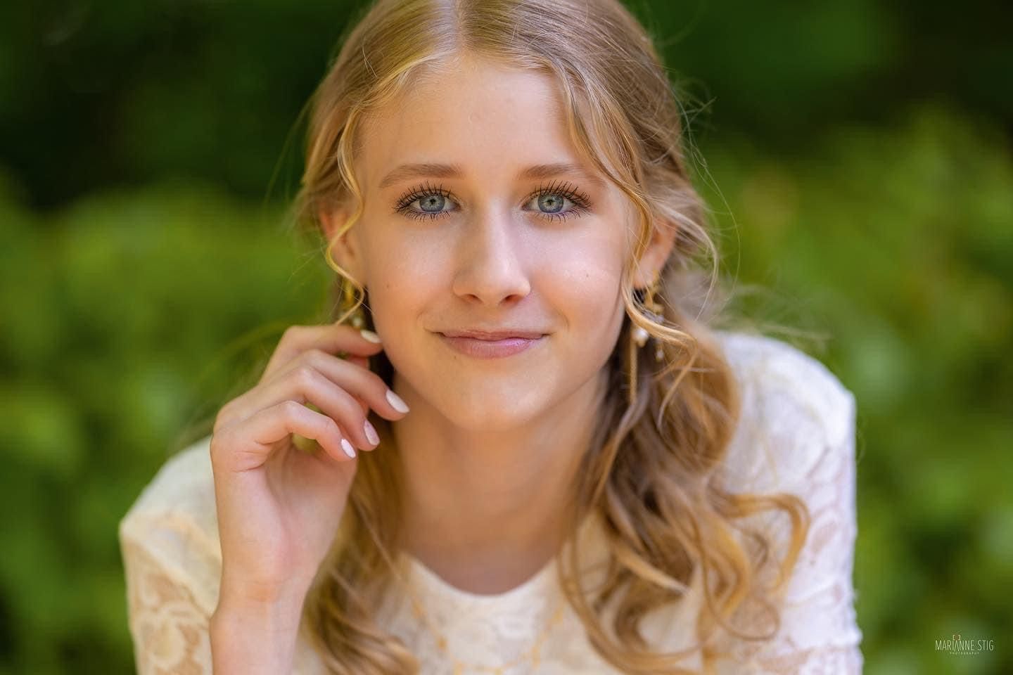 Portrait series of person in white dress outdoors with natural lighting.