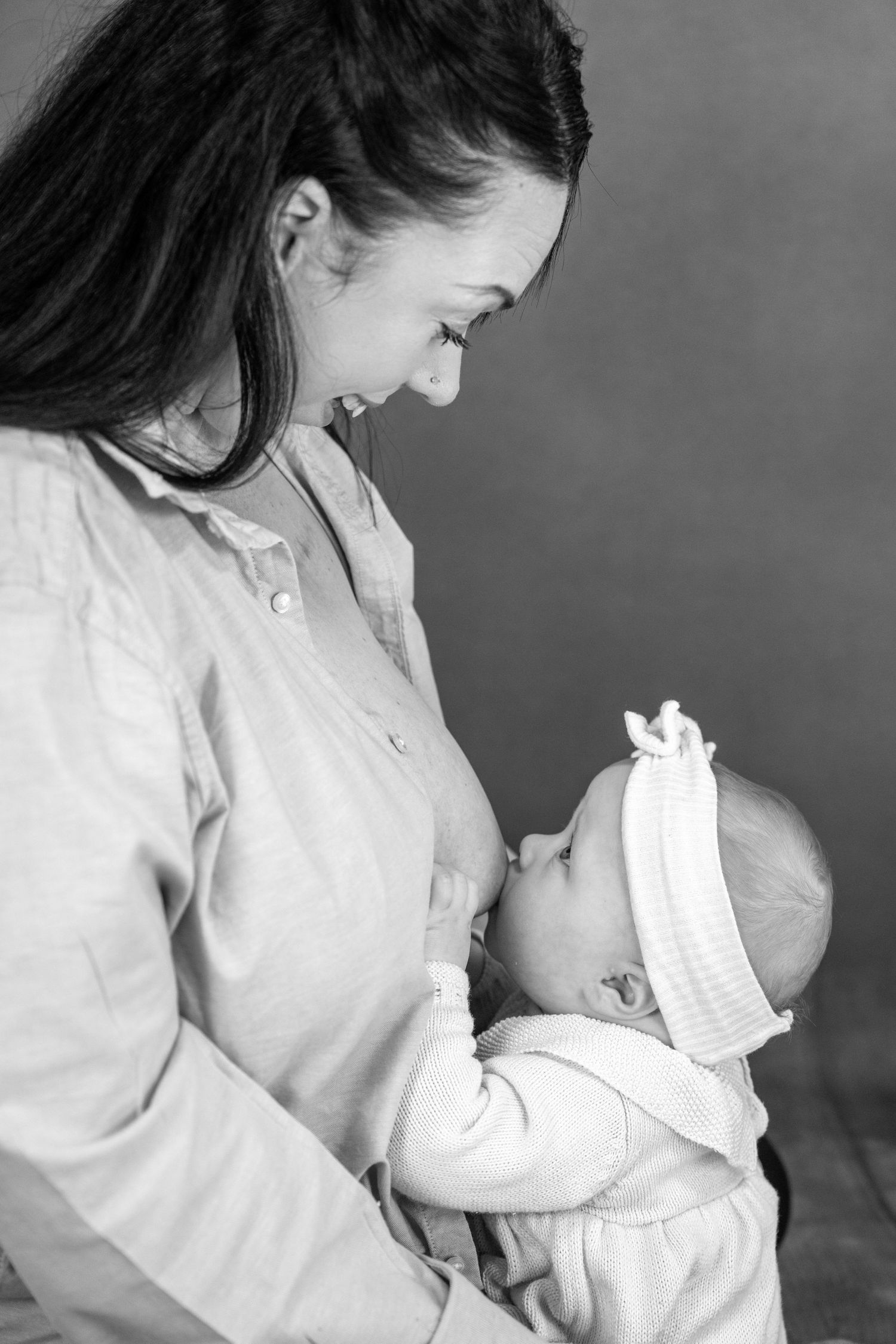 Professional Breastfeeding Photoshoot looking at Mama
