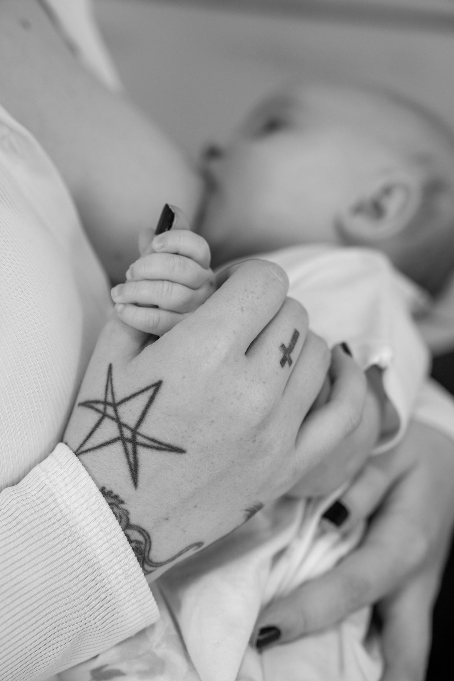 Professional Breastfeeding Photoshoot holding hands