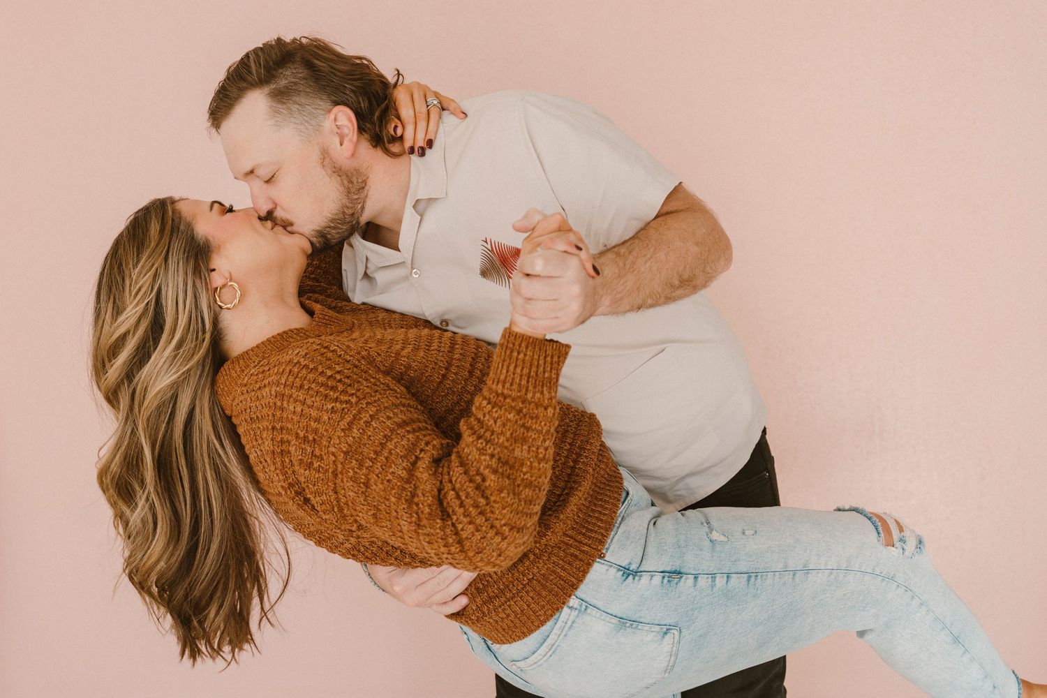Couples photography session in a studio Denton Texas. Husband dipping and kissing wife.