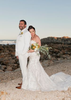 Bride & groom posing on the beach, during sunset  at Casa da Baleia, Gouritsmond
