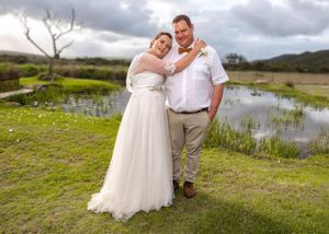 Bride & groom posing at their wedding at Kleingeluk, Hartenbos