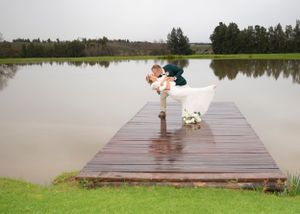Bride & Groom posing on a jetty at Morgansvlei, Tulbagh.