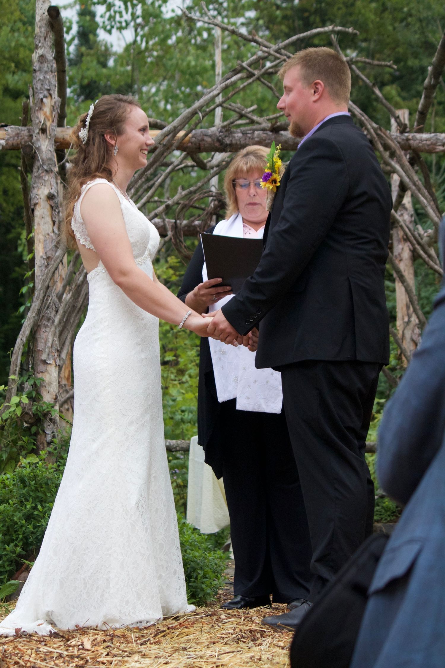 a bride and groom at the alter at their fall wedding