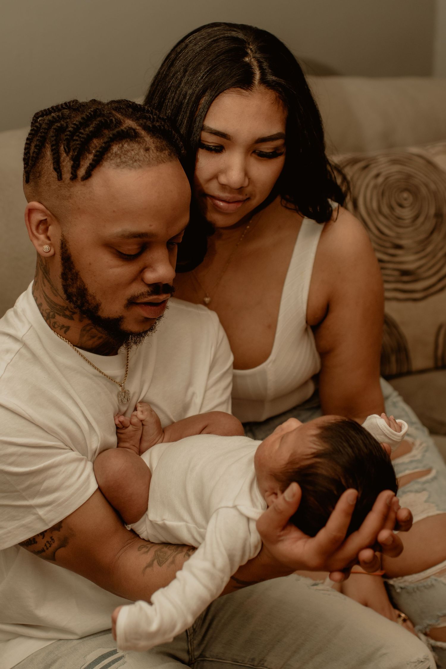 mom and dad admiring new baby boy.