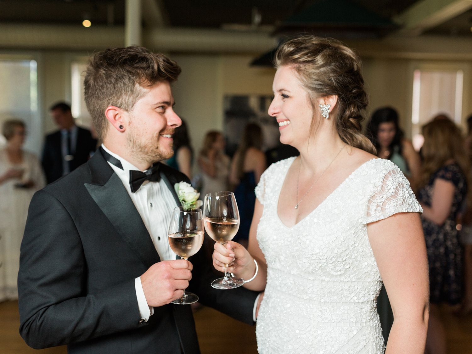 bride and groom toast during their indoor wedding reception in san francisco