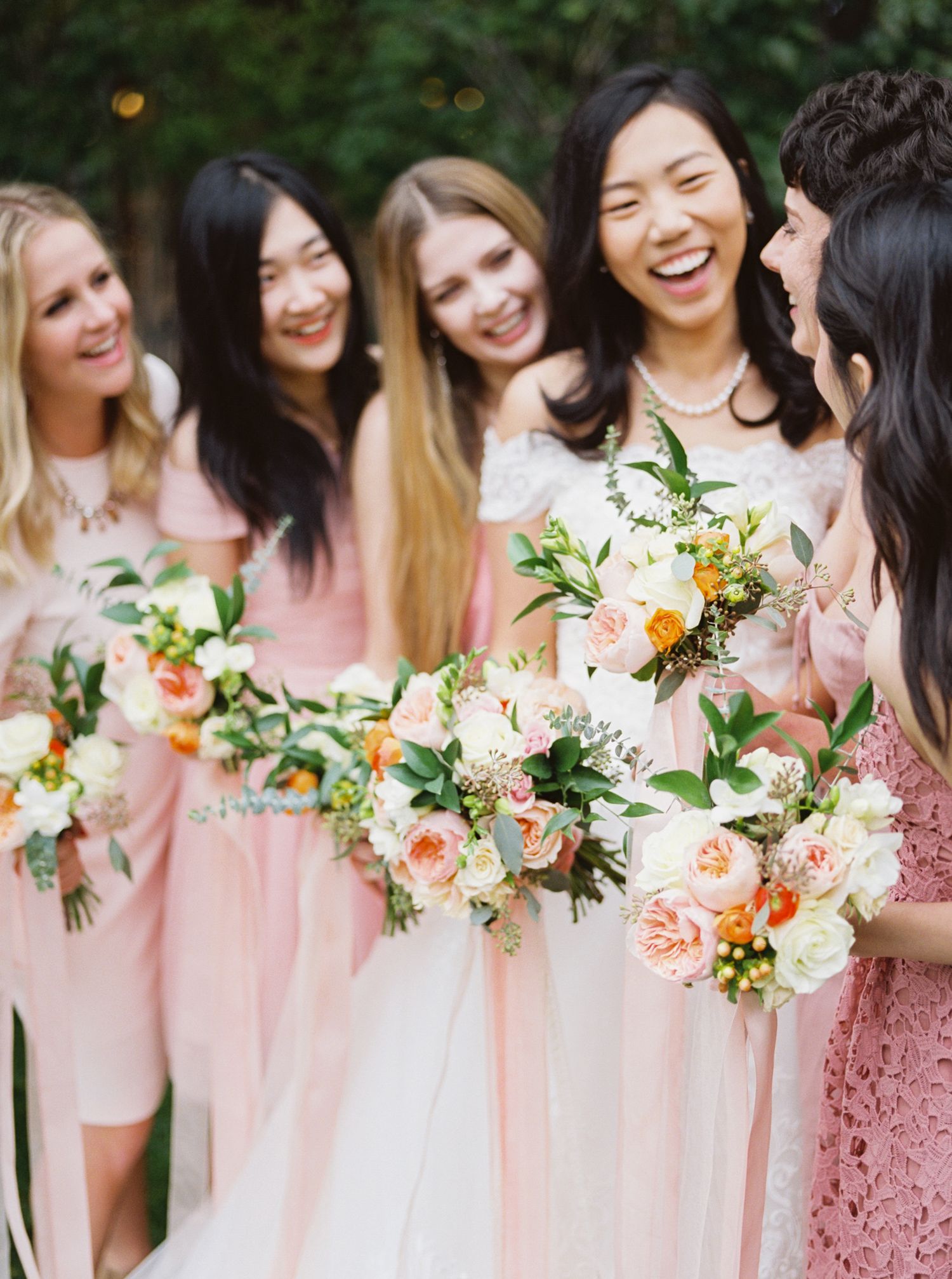 taiwanese bride laughing with her bridesmaids at historic wadley farms utah county
