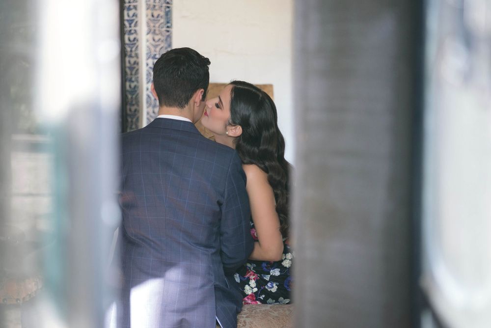girl kissing a boy in their engagement session