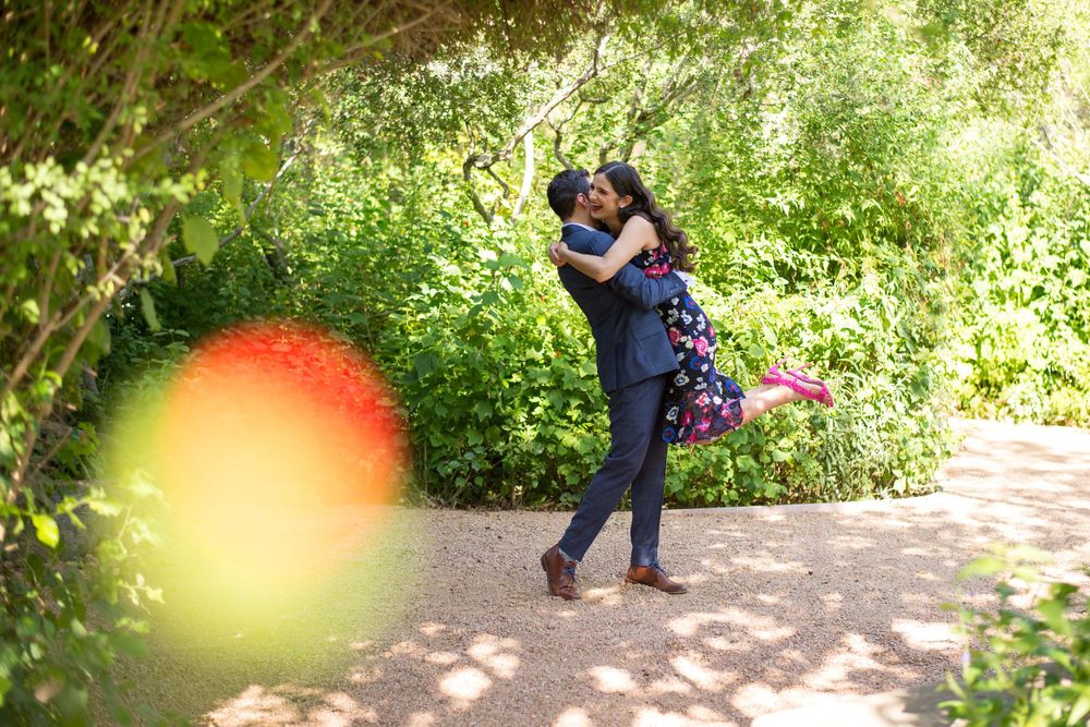 happy boyfriend lifting the girlfriend at the engagement session