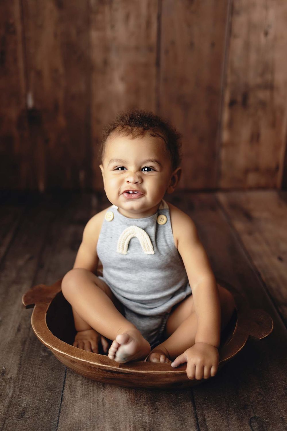baby sitting in prop at photo session