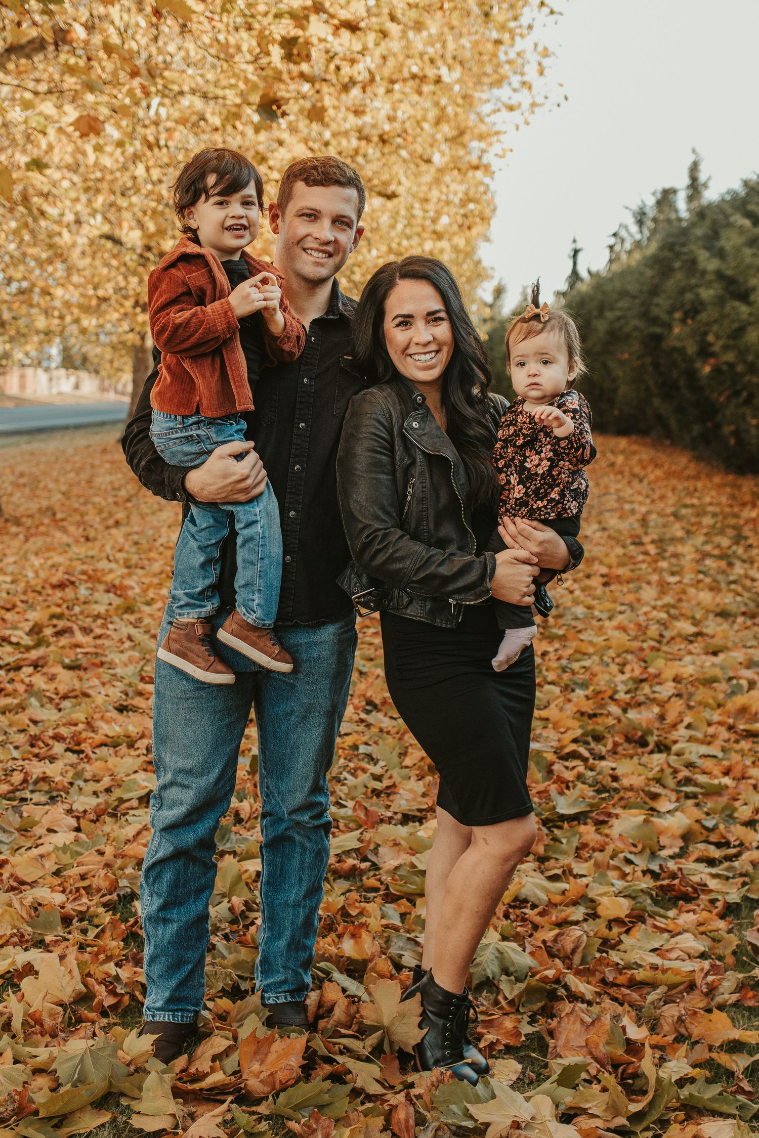 family photo of elishia jackson photography with fall colored leaves all around. spokane photographer, north idaho photographer, cda, cheney