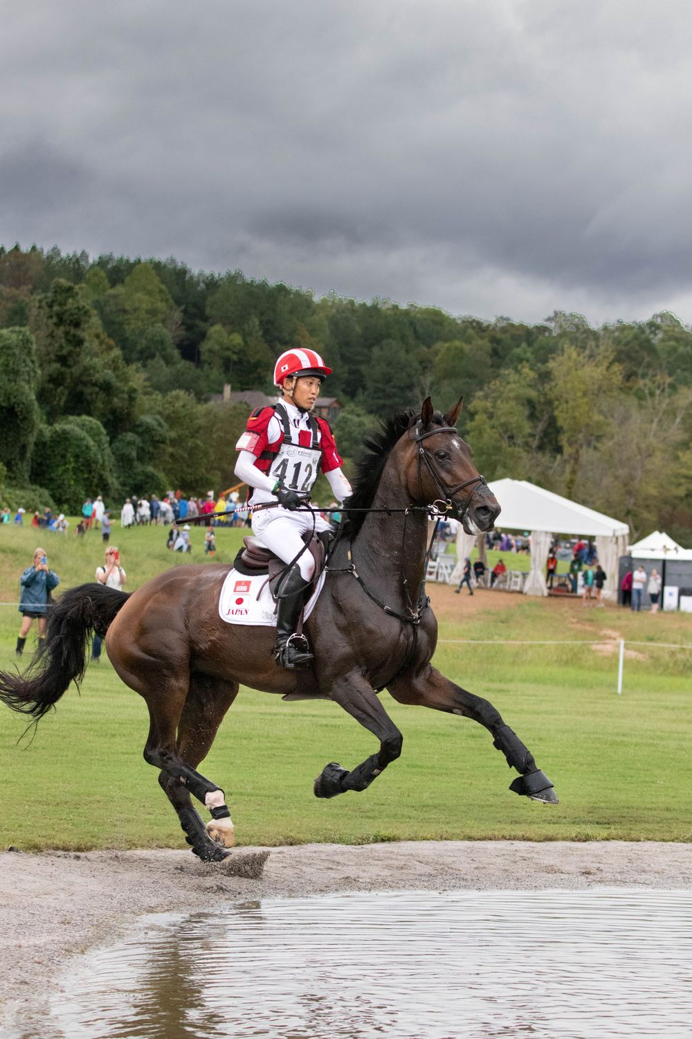 horse and rider enter water during cross country