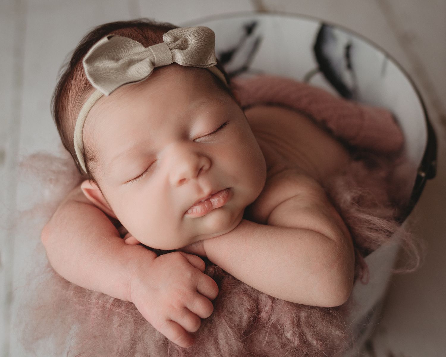 baby girl pink blanket in a bucket