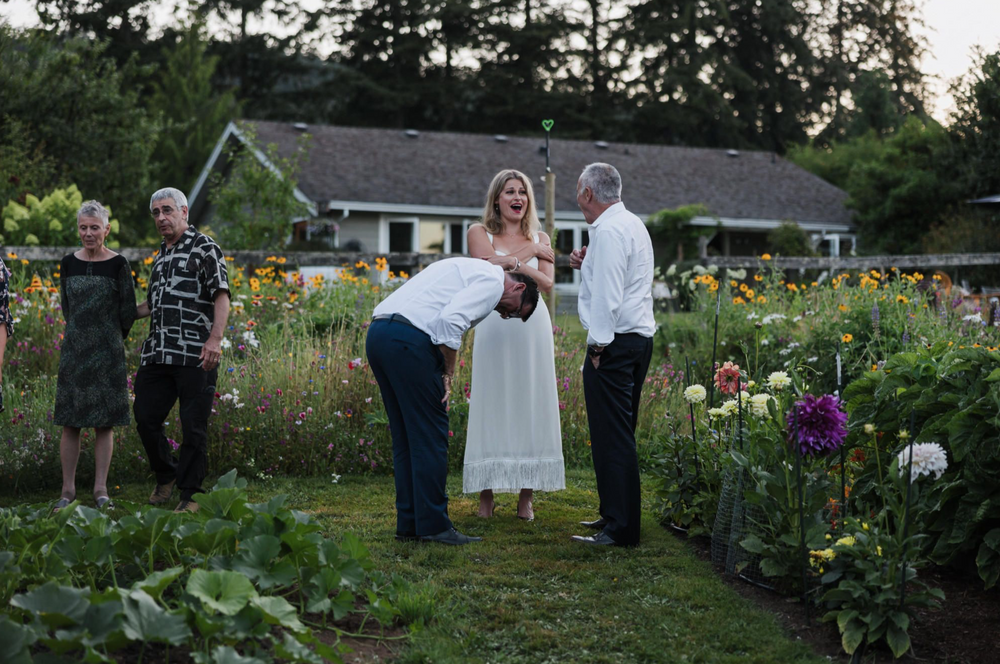 Emery and Matt share a laugh with a wedding guest in Victoria, B.C.