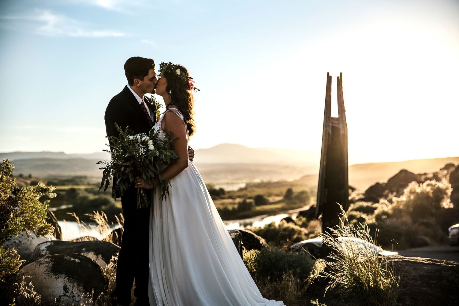 Bride and Groom share a kiss during their elopement photographed at Celebration Park in Nampa, Idaho.