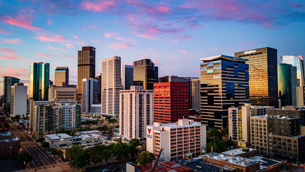 Aerial/drone photo of Downtown Denver at sunrise by Denver Drone, Hospitality, Travel & Tourism photographer Captain Colorado Photography.