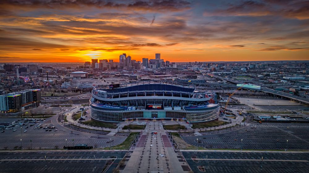 Aerial/drone photo of Empower Field at sunrise by Denver Drone, Hospitality, Travel & Tourism photographer Captain Colorado Photography.