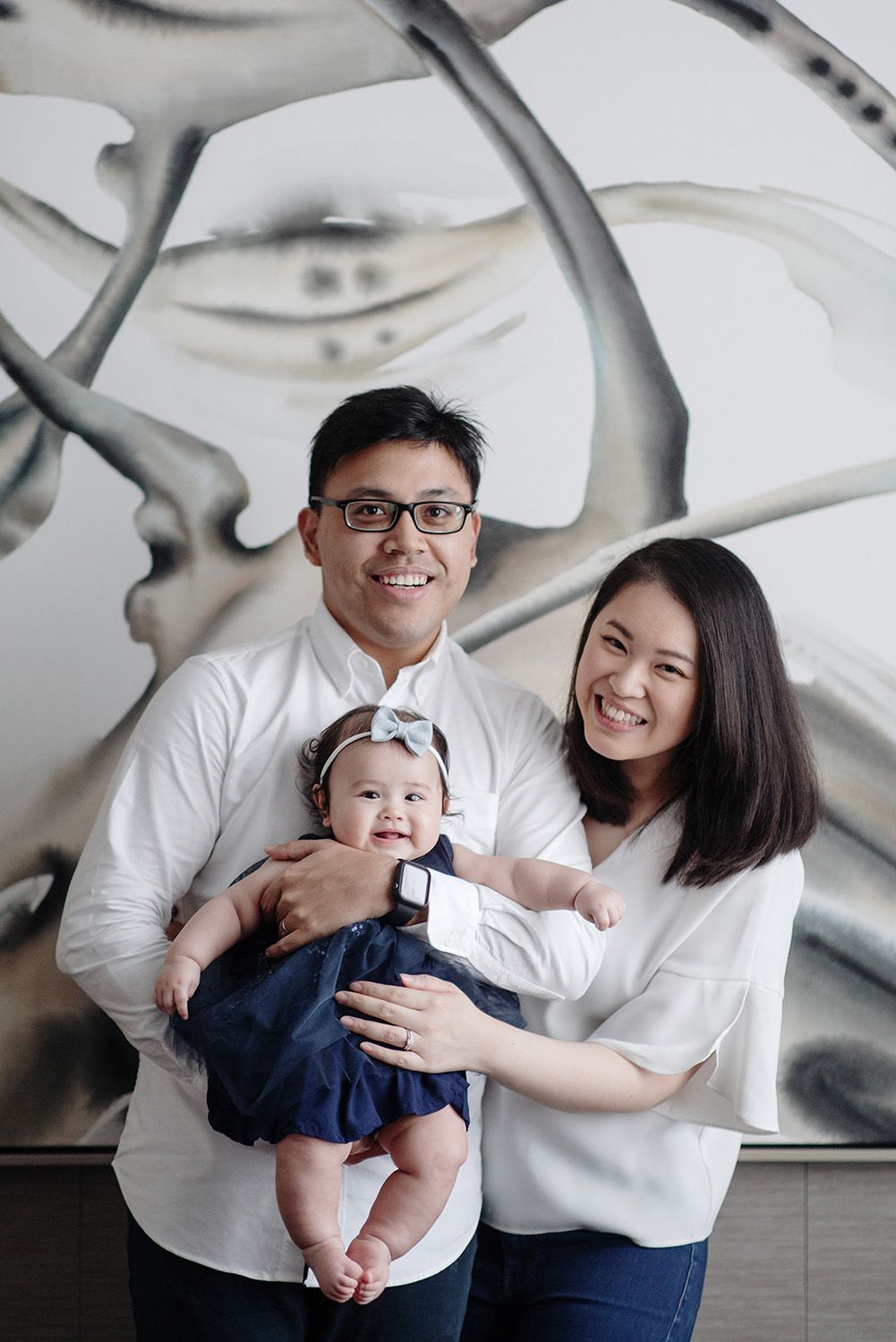 Parents holding their baby