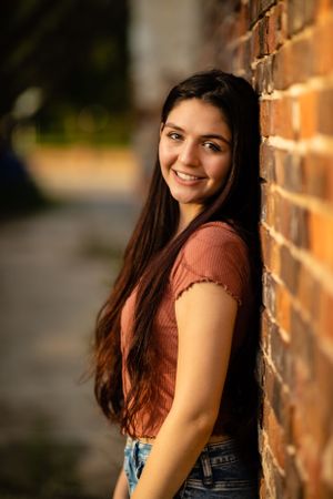 high school senior girl photo session downtown brick wall