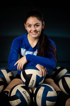 High school senior girl plays volleyball sport