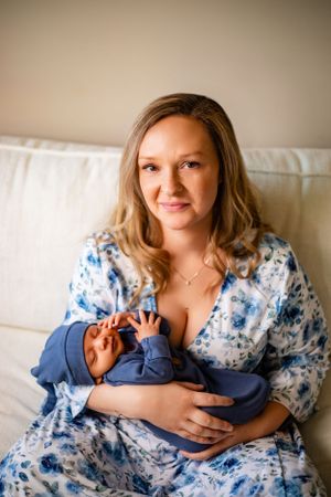 In home lifestyle newborn photo session with mom and baby boy matching