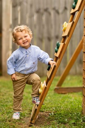 little boy posing on playground for children's portrait