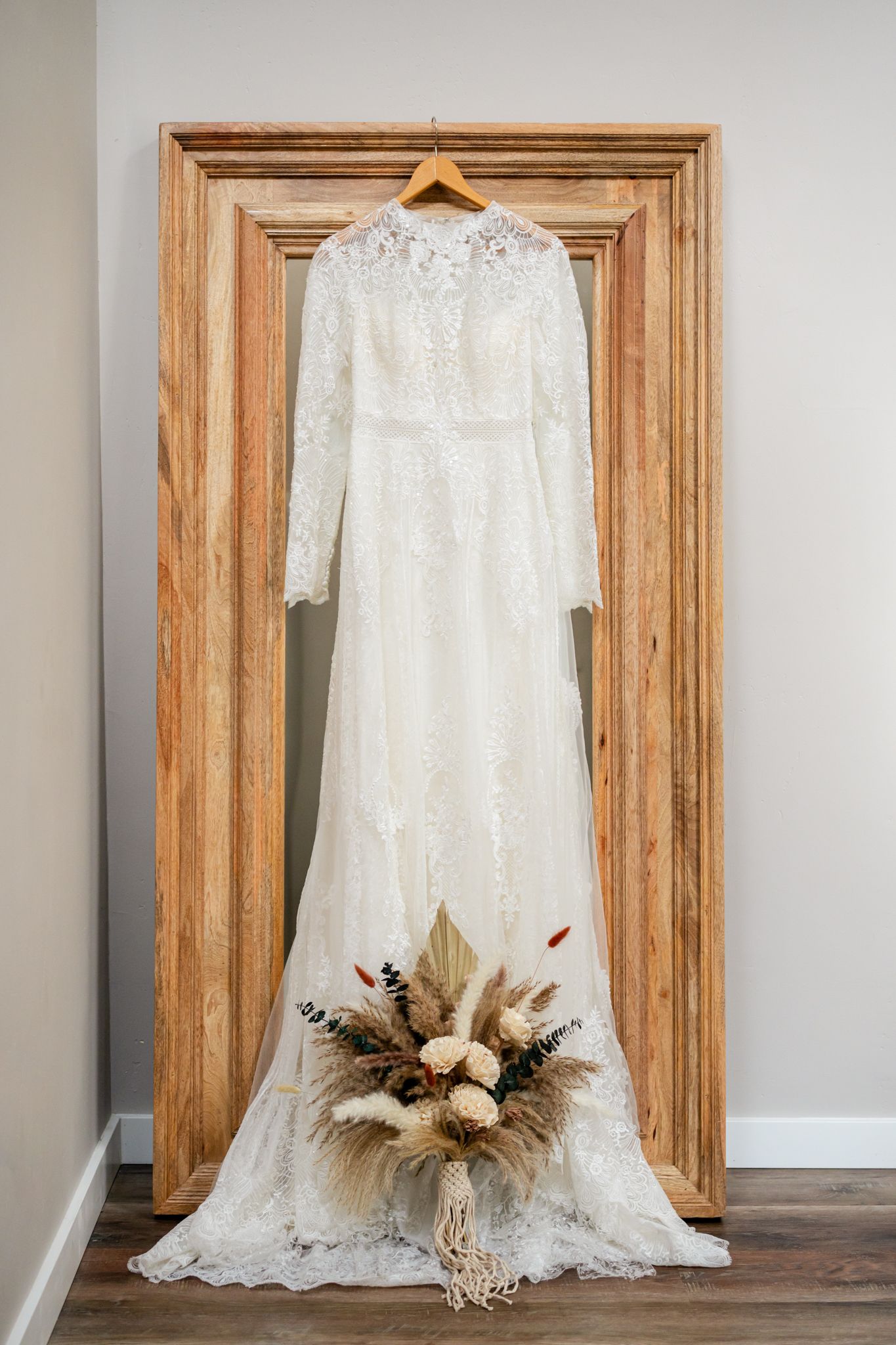 bride's dress and bohemian style bouquet