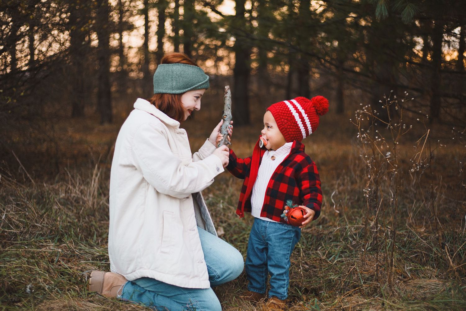 token creek county park deforest madison wi family photography christmas mini session mom playing with son holding stick