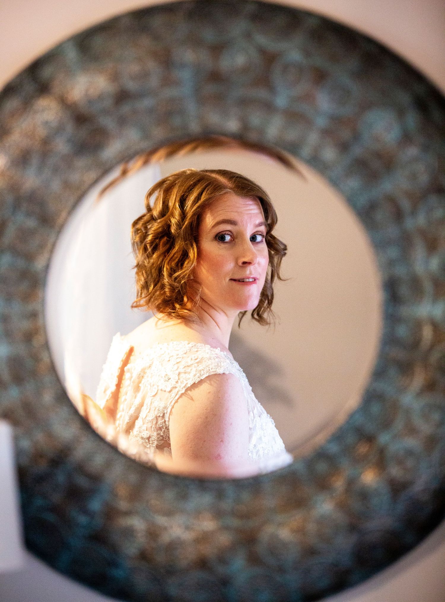 Artistic wedding portraits framed through vintage oval frames showing romantic bridal moments.