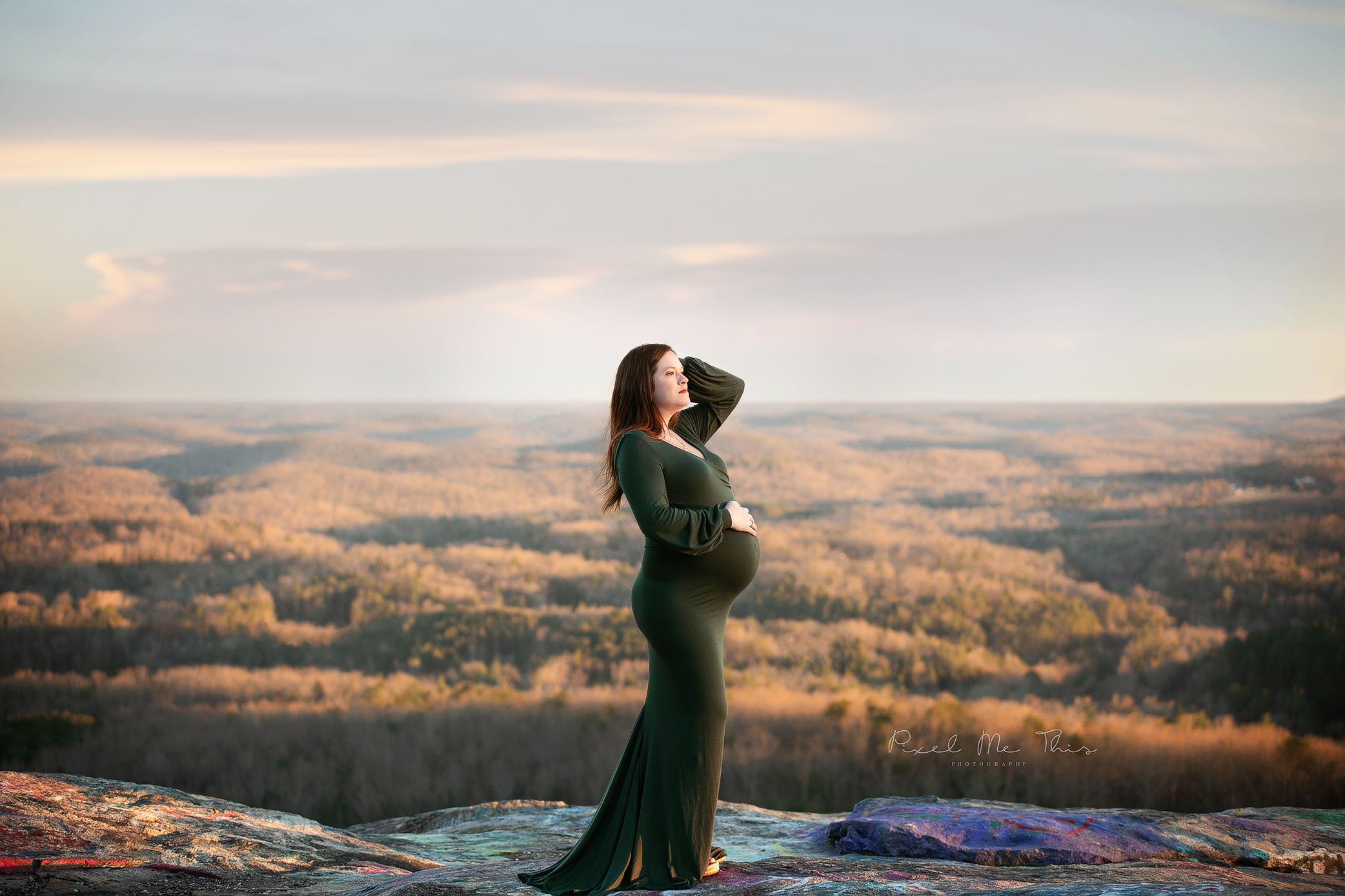 Maternity mom holding her belly on top of a mounatin. Greenville, SC newborn photographer, Easley, SC Newborn photographer