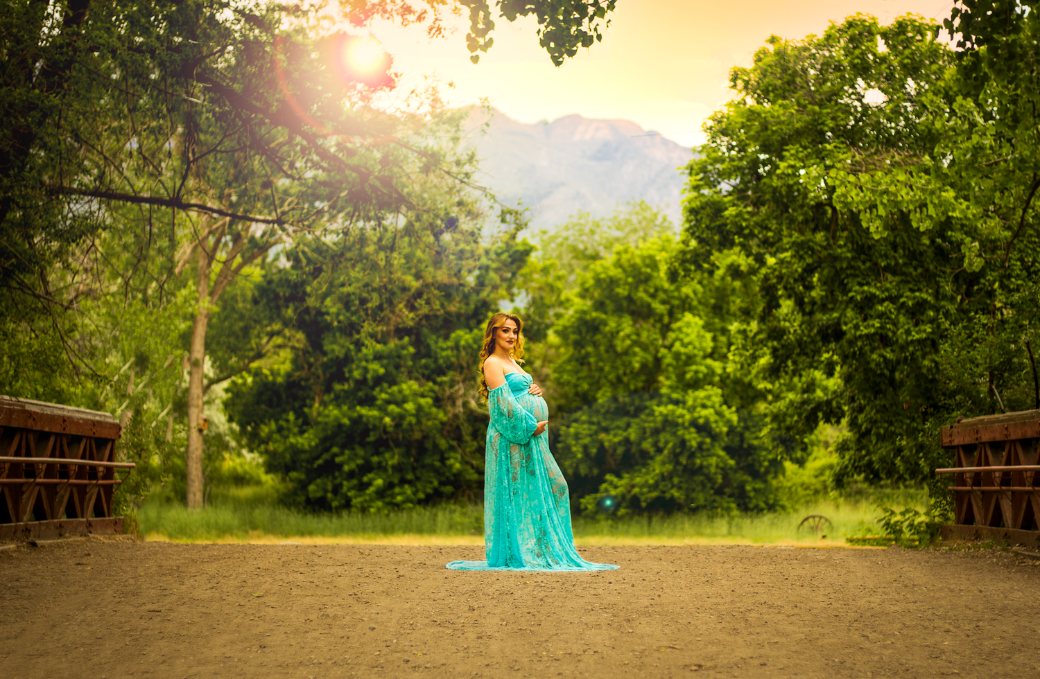 Woman showing off her pregnant belly at Wheeler Farm, Murray, Utah.